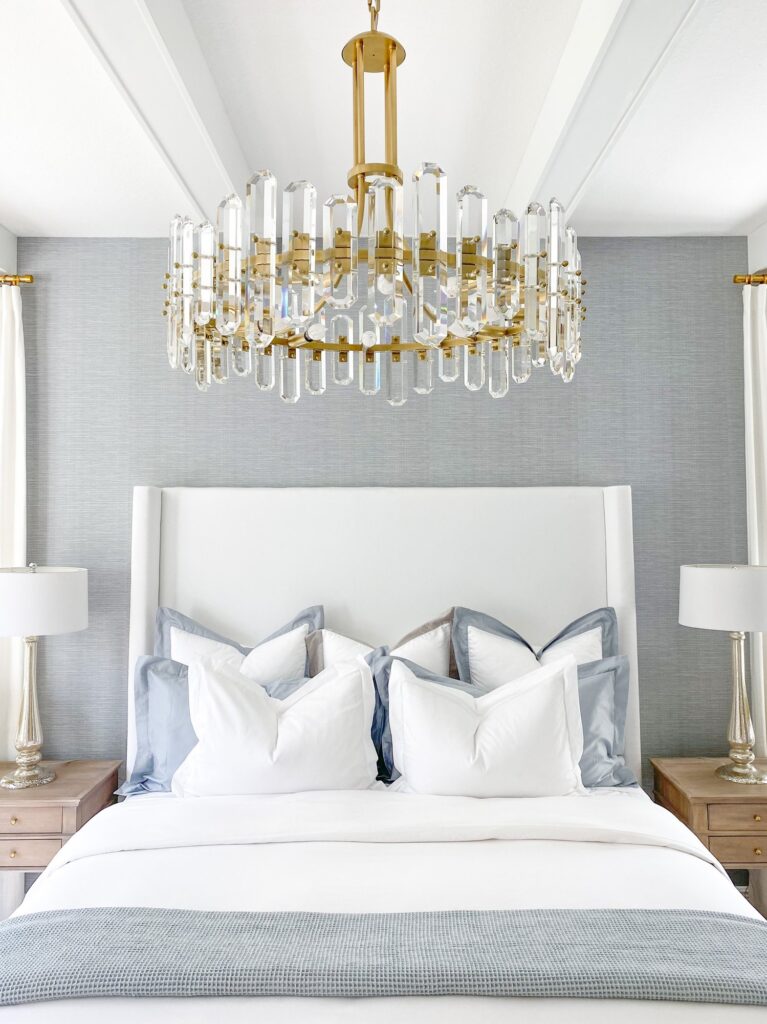 Master bedroom home decor transitional style decor with lighting over bed.