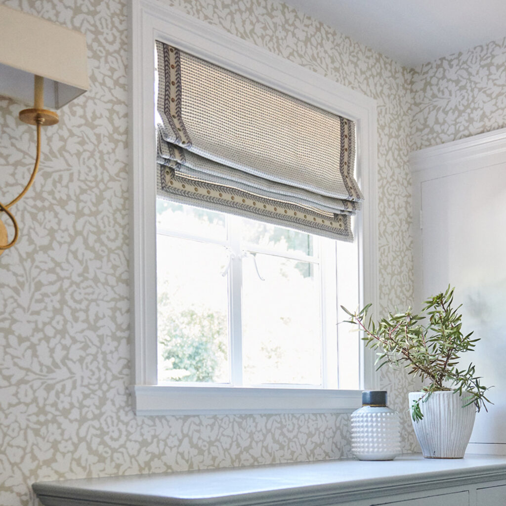 Revolution fabrics on a roman shade window treatment in a bath.