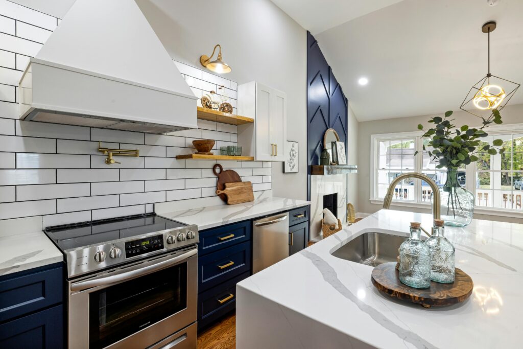 Coastal design kitchen remodel with blue and white cabinets with quartz countertops. Kitchen renovation Houston.