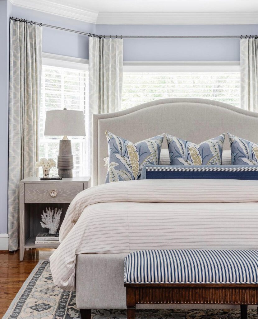 Revolution fabrics in a master bedroom with a coastal vibe design. In creams and soft blues.