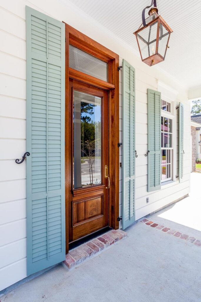 Exterior shutters on a front door area.