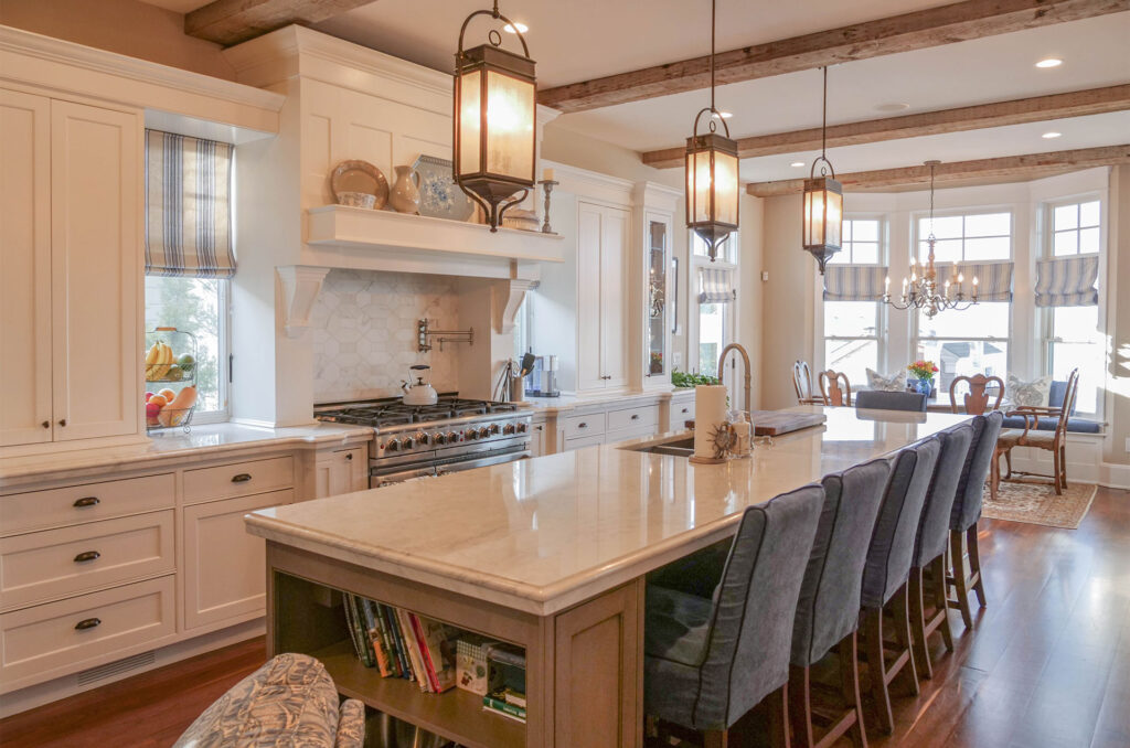 Transitional style kitchen remodel. With a large island and wood beams on the ceiling. Kitchen renovation Houston.