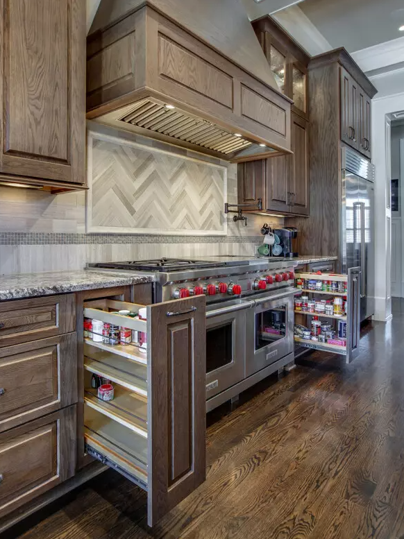 Kitchen remodel with cabinet storage for spices. Kitchen renovation Houston.